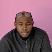 Kevin Hill, looking at the camera with glasses pushed up on his forehead.